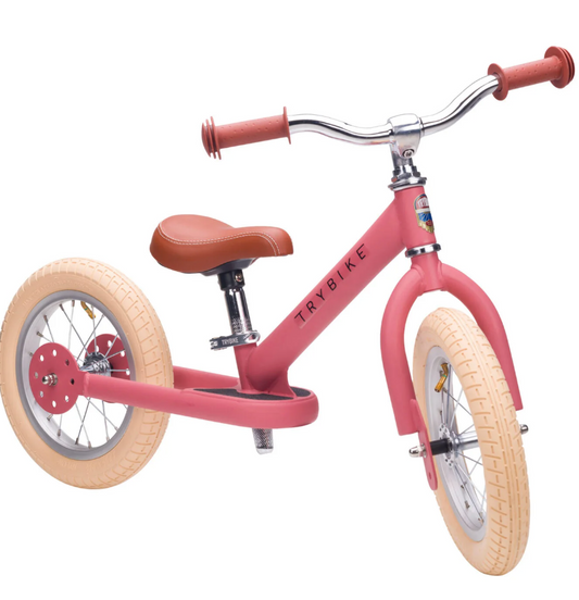 Pink balance bike with brown seat and handlebar grips. 2-IN-1 TRIKE & BALANCE BIKE - VINTAGE PINK | TRYBIKE