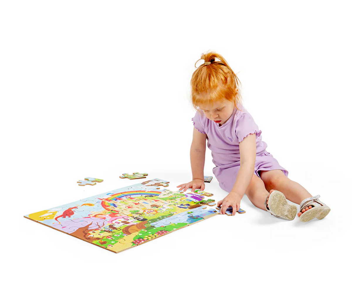 Lifestyle — toddler girl placing pieces on the floor, scale clearly shown