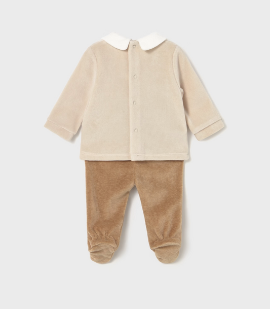 Mayoral Baby Cosy Jumper and Footed Trouser Set in Toffee — back ghost flat-lay on light grey background; two-piece velour baby outfit; cream/oat velour long-sleeve jumper showing the plain back with white Peter Pan collar visible from behind at the neckline; back popper closure running down the centre back of the jumper for easy dressing; long sleeves with turned-back cuffs; warm toffee/caramel velour footed trousers with integrated feet; light grey background; demonstrates the back silhouette and the back