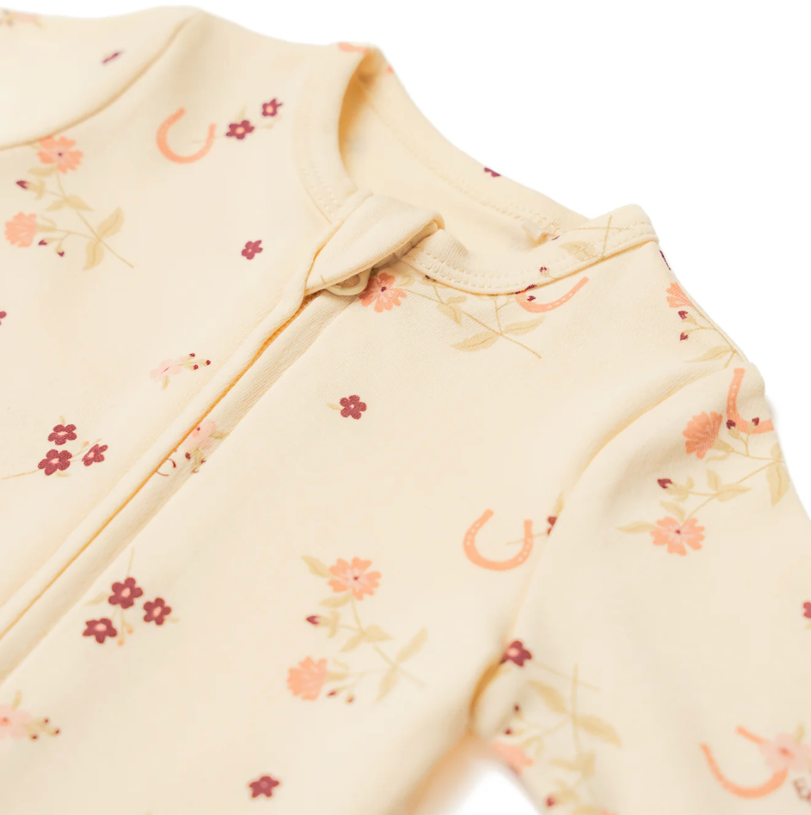 Baby romper with floral pattern. ORGANIC COTTON ZIP BABY SLEEPSUIT - HORSESHOE FLORAL