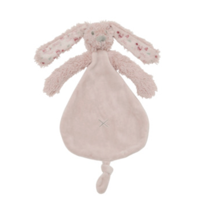 A soft plush bunny lovey comforter in a pale blush pink color, featuring long floppy ears with a subtle floral pattern and a stitched X on the front.