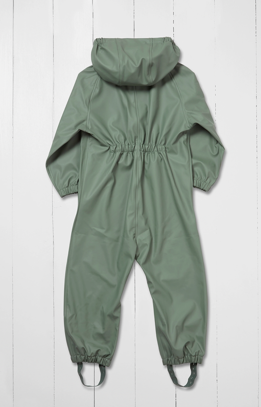 Grass & Air children's waterproof puddle suit in muted sage khaki green — back view flat lay on white background showing attached hood, elasticated back panel at waist for shape and fit, long sleeves and full-length legs with integrated boot stirrups