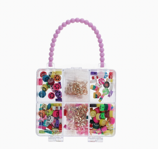 Children's jewellery-making kit by Rex London in a handbag-shaped storage container with divided compartments to organise beads and findings.