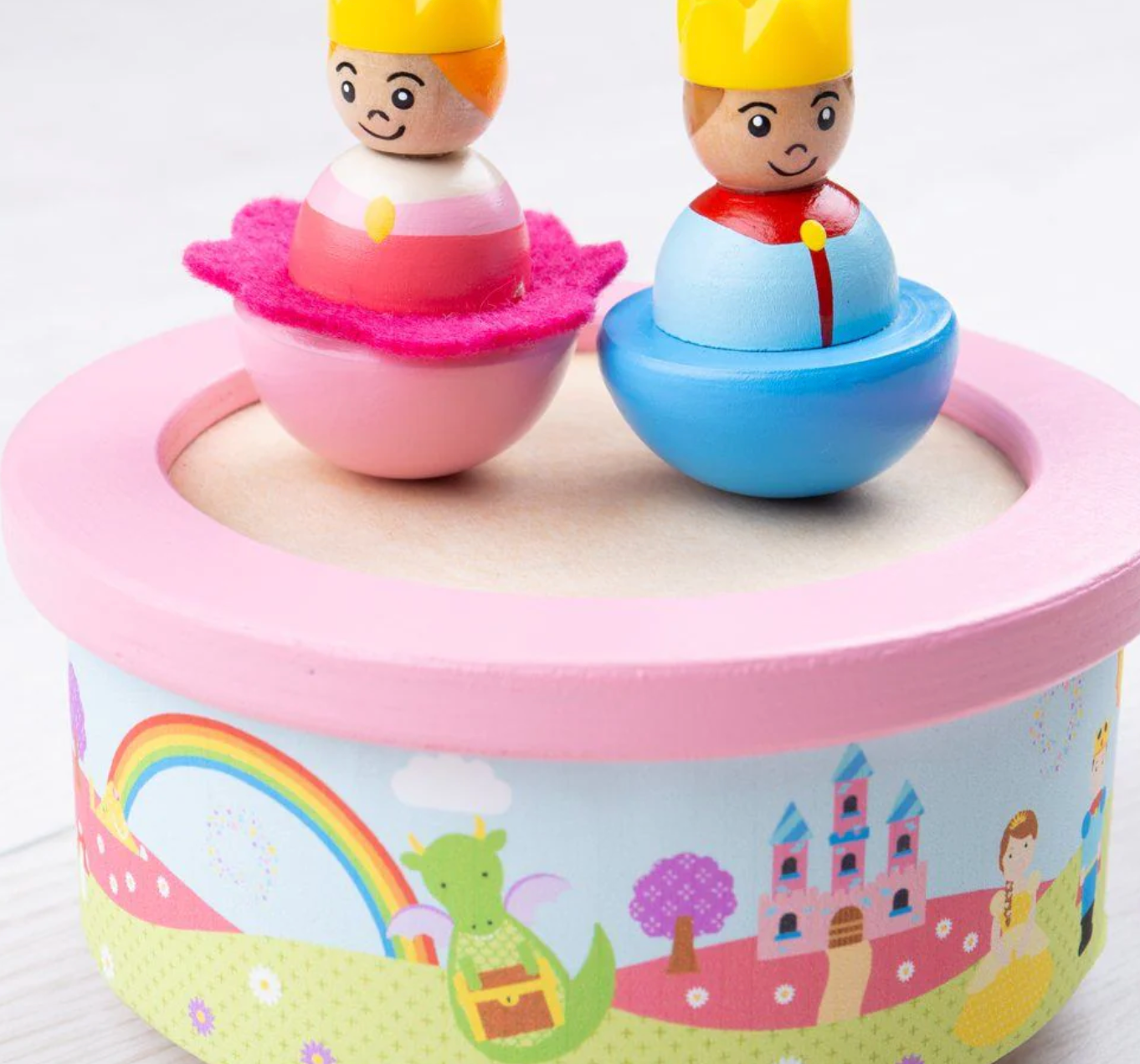 Wooden toy figures on a colorful circular base with cartoon design WOODEN FANTASY MUSIC BOX | BIGJIGS