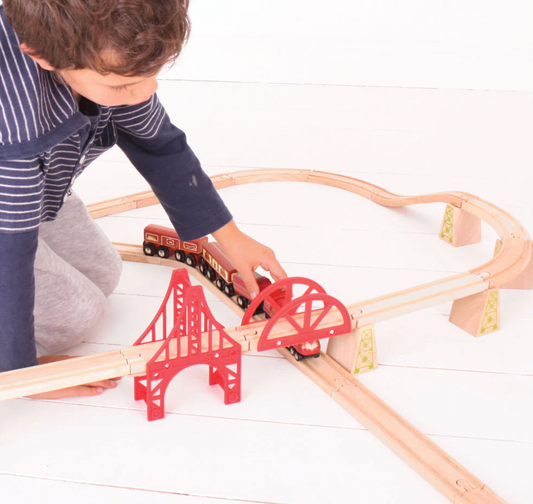 Child playing with a wooden train. WOODEN HERITAGE COLLECTION DUCHESS OF HAMILTON | BIGJIGS RAIL