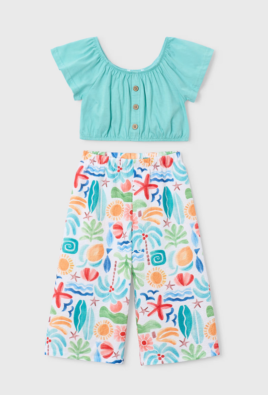 The girls Holiday Oasis wide-leg trouser co-ord set styled beautifully as a premium resort clothing gift for kids.