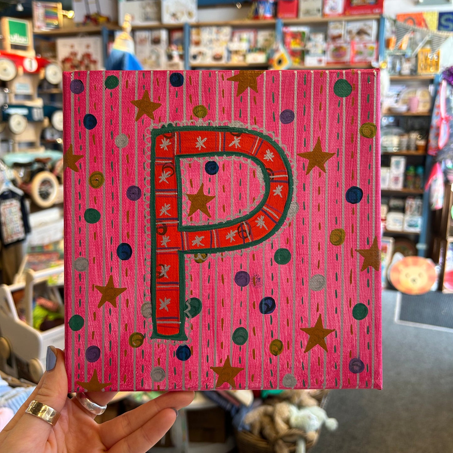 Close-up detail of the textured, multi-dimensional layered paint technique on the P. Sloan & Daughter monogram canvas.