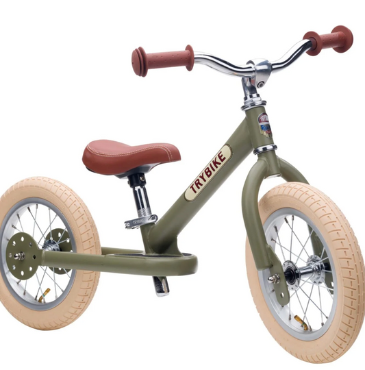 Green balance bike with brown seat and handlebaR. 2-IN-1 TRIKE & BALANCE BIKE - VINTAGE GREEN | TRYBIKE