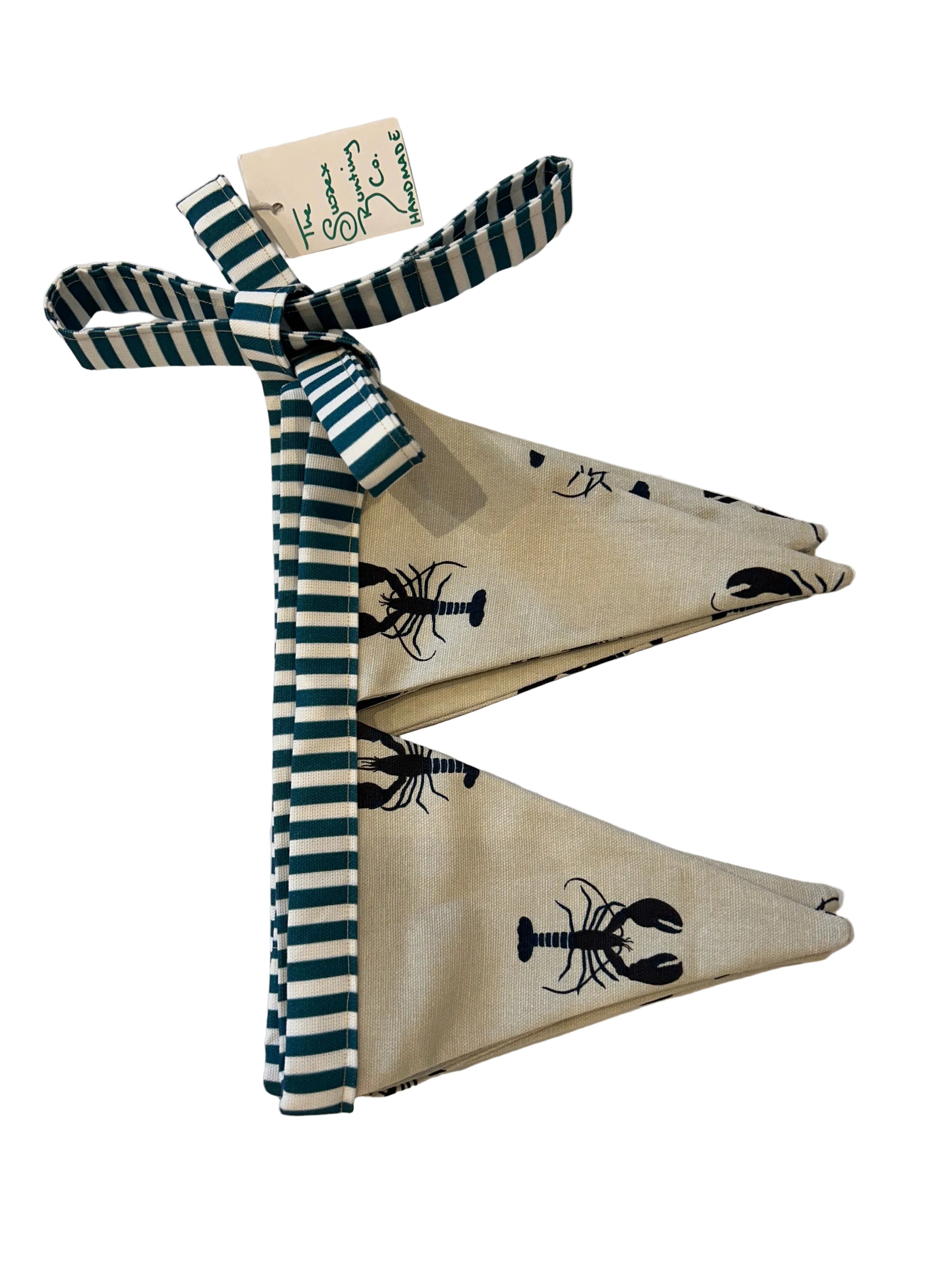 fabric bunting with lobster design and striped trim on a white background.