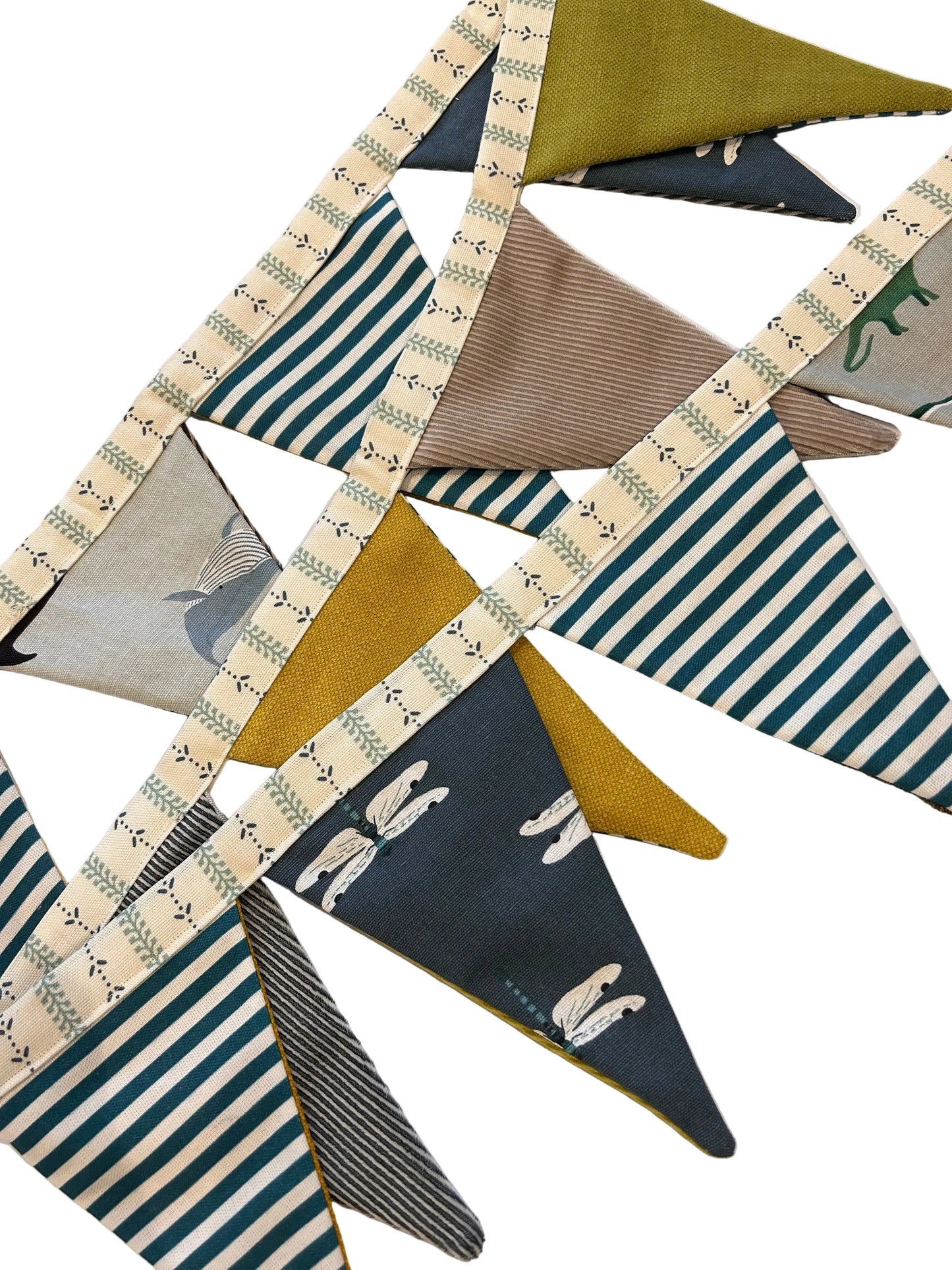 Collection of patterned fabric triangles on a wooden surface