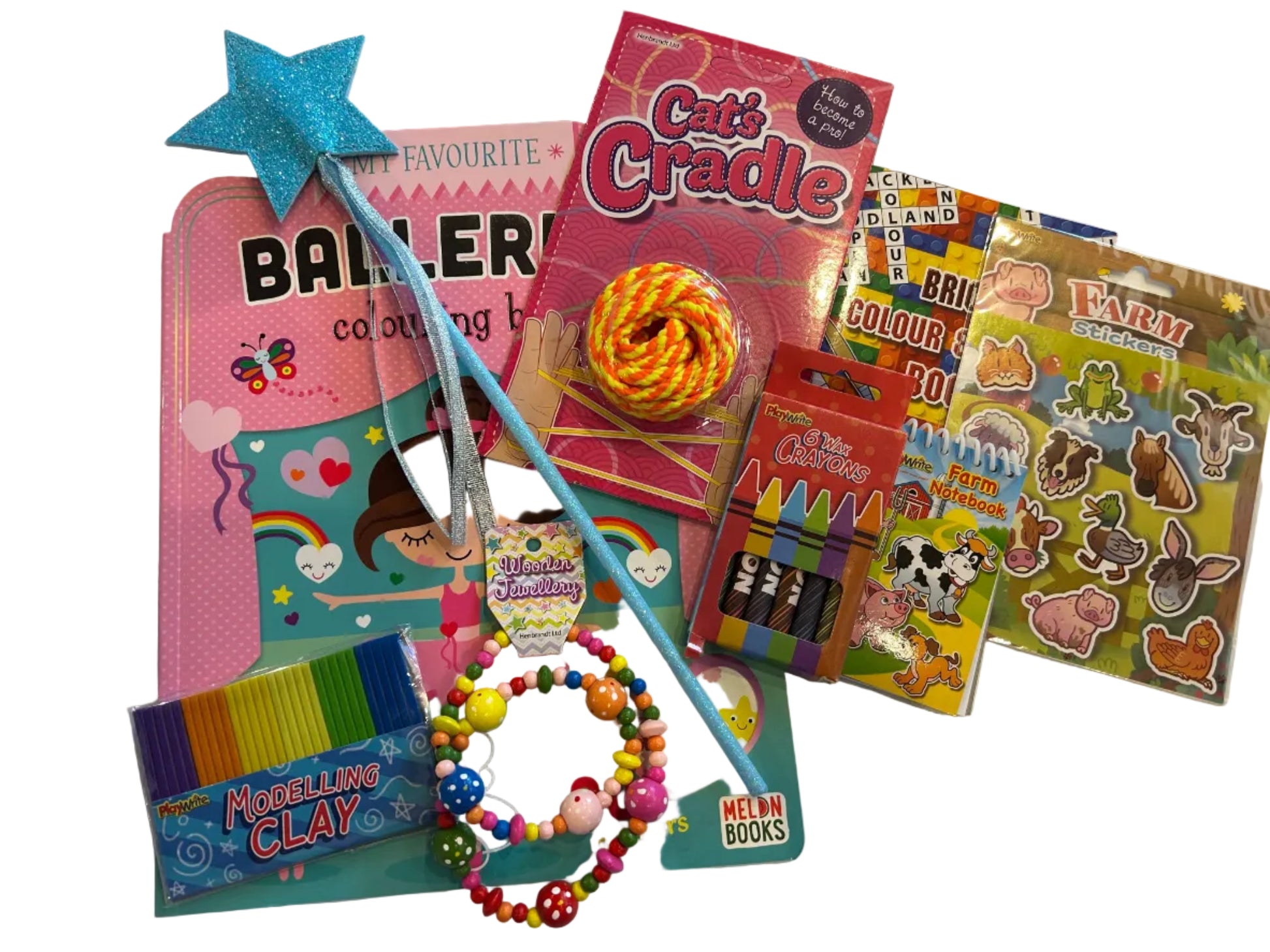 A children's toy and craft bundle arranged on a white fabric surface, including a pink coloring book, a blue star wand, a 'Cat's Cradle' toy, crayons, bead bracelets, stickers, and modeling clay.