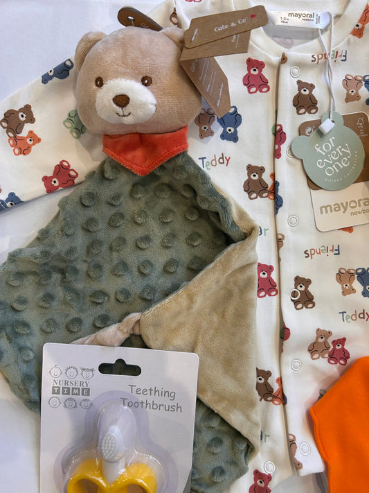 Close-up of bear comforter with bobble texture and Mayoral teddy bear print baby grow from the Welcome to the World baby gift set