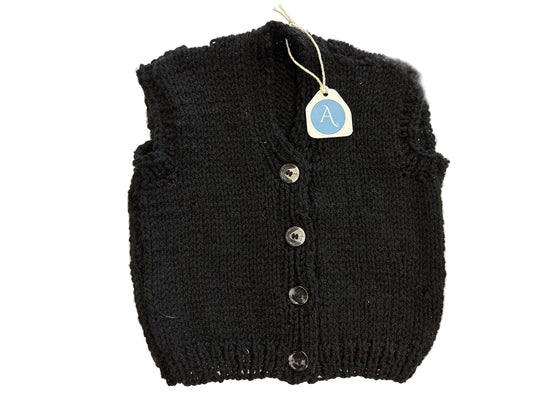 Black knitted vest with buttons on a white background