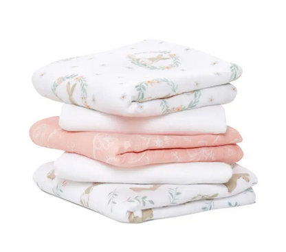 Stack of soft, patterned fabric swaddles. ADEN + ANAIS 5 PACK BABY MUSLIN SQUARES - BLUSHING BUNNIES