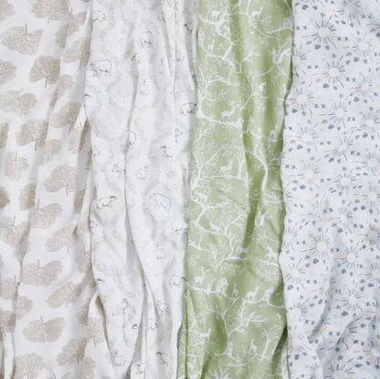 Three pieces of fabric with different patterns and colors arranged side by side. ADEN + ANAIS COTTON BABY SWADDLE 4 PACK - HARMONY