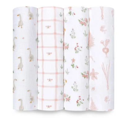 Four rolls of fabric with different patterns on a white background. ADEN + ANAIS COTTON SWADDLE 4 PACK - COUNTRY FLORAL