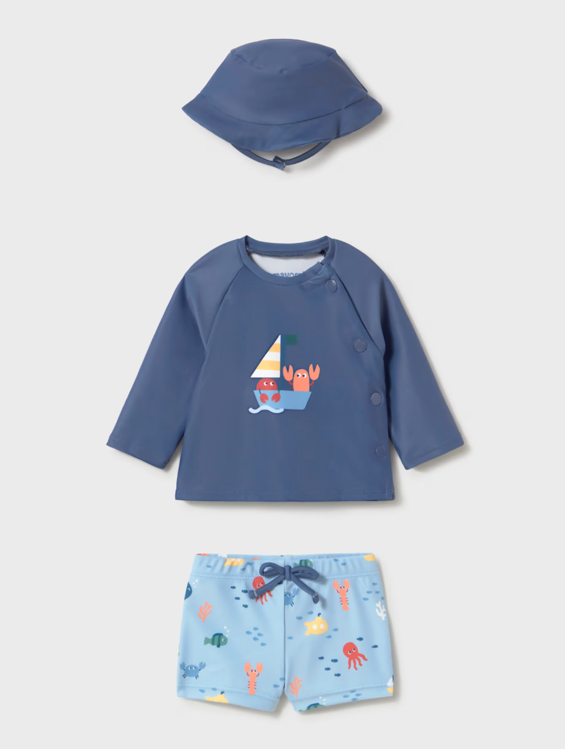Children's blue shirt with sailboat design, matching hat, and colorful shorts. BABY BOY BLUE SWIM BEACH SET - SUN PROOF TOP, SHORTS AND HAT | MAYORAL