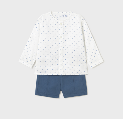 White long-sleeve shirt with small pattern and blue shorts on a light gray background BABY SHORTS WITH PRINT SHIRT SET | MAYORAL 