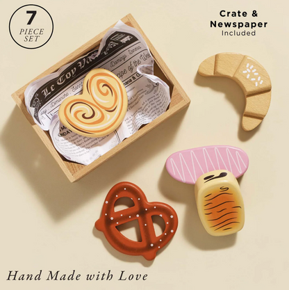 Set of handcrafted wooden toys shaped like a heart, crescent moon, pretzel, and mushroom on a beige background. BAKERY & PATISSERIE MARKET CRATE WOODEN TOY | LE TOY VAN