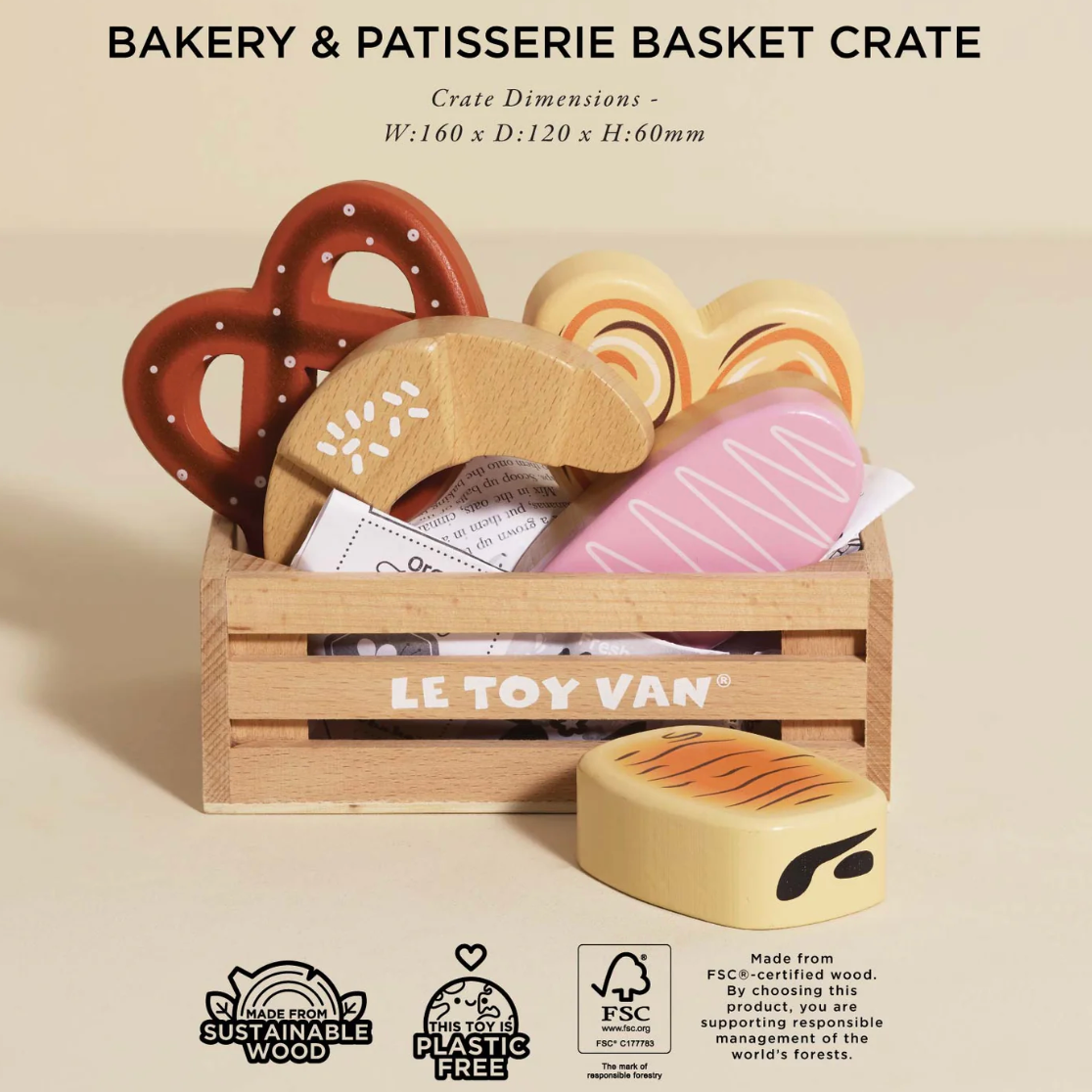 Wooden crate with toy bakery items and Le Toy Van branding on a beige background. BAKERY & PATISSERIE MARKET CRATE WOODEN TOY | LE TOY VAN