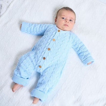 Dandelion Blue cable knitted baby romper with brown wood buttons . BASKET WEAVE BABY ONSIE - BLUE | KNITTED UNISEX BABY ROMPER | DANDELION