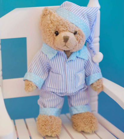Powell Craft cuddly bear in blue nightwear.