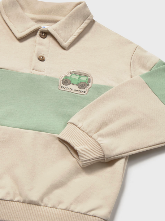 Mayoral boys' rugby polo pullover — close-up detail showing the two wooden buttons, polo collar, and woven chest badge featuring a green 4x4 with roof rack and "explore nature" text on the matcha green stripe