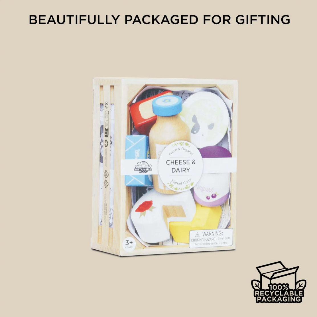 Packaged toy set with 'Cheese & Dairy' theme on a beige background, featuring recyclable packaging icon. CHEESE & DAIRY WOODEN TOY MARKET CRATE | LE TOY VAN