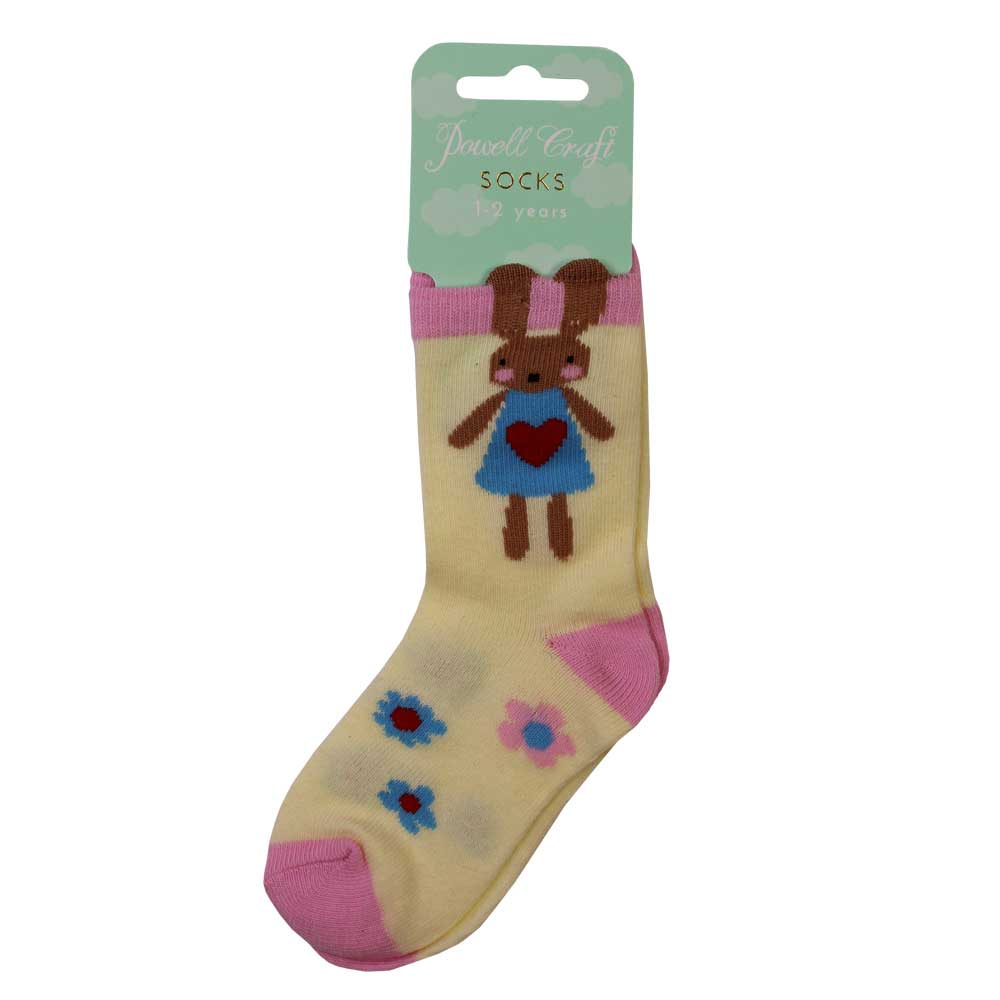 Beige sock with cartoon character and floral design on a white background. CHILDREN'S BUNNY RABBIT & DAISY SOCKS - 3 SIZES | POWELL CRAFT