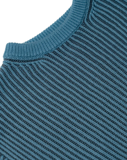 Close-up of a blue ribbed sweater collar and sleeve. CHILDREN'S CHUNKY KNIT CLASSIC JUMPER | ELEANOR CHARLES
