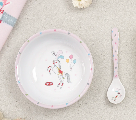 Children's plate and spoon set with unicorn design on a light gray surface CHILDREN'S MELAMINE BABY SPOON - FAIRGROUND PONIES | SOPHIE ALLPORT