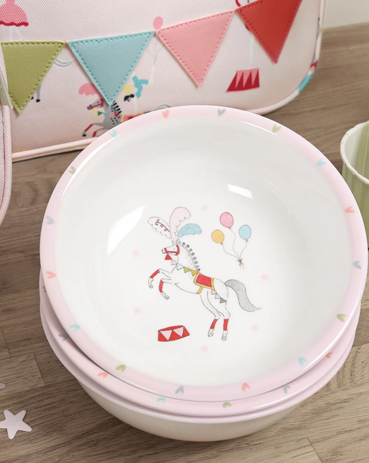 Children's bowl with a unicorn design on a wooden surface CHILDREN'S MELAMINE BOWL - FAIRGROUND PONIES | SOPHIE ALLPORT