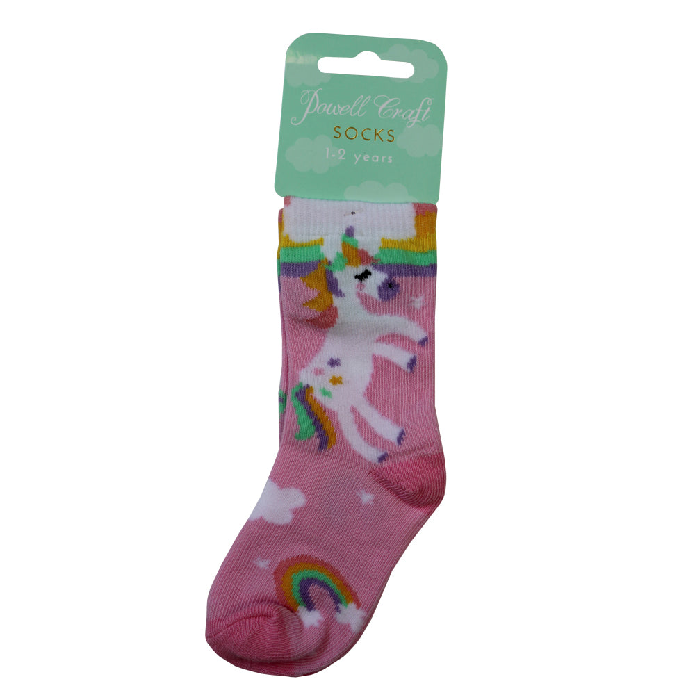 Pink children's sock with unicorn and rainbow design on a white background. CHILDREN'S PINK UNICORN & RAINBOW SOCKS - 3 SIZES | POWELL CRAFT