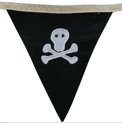 Black triangle-shaped flag with a white skull and crossbones design. CHILDREN'S PIRATE BUNTING FOR BEDROOMS & PARTIES | POWELL CRAFT