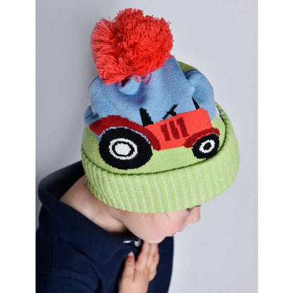 Colorful knit hat with a red pom-pom and toy truck design. CHILDREN'S RED TRACTOR & SHEEP KNITTED HAT WITH POM-POM | POWELL CRAFT