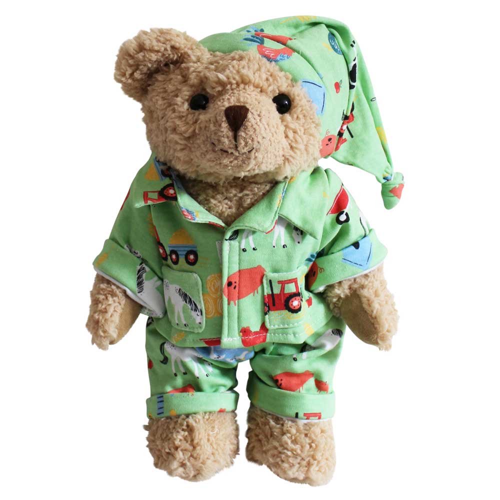 Teddy bear in green animal-themed pajamas. CUDDLY TEDDY IN FARMYARD PYJAMAS | POWELL CRAFT