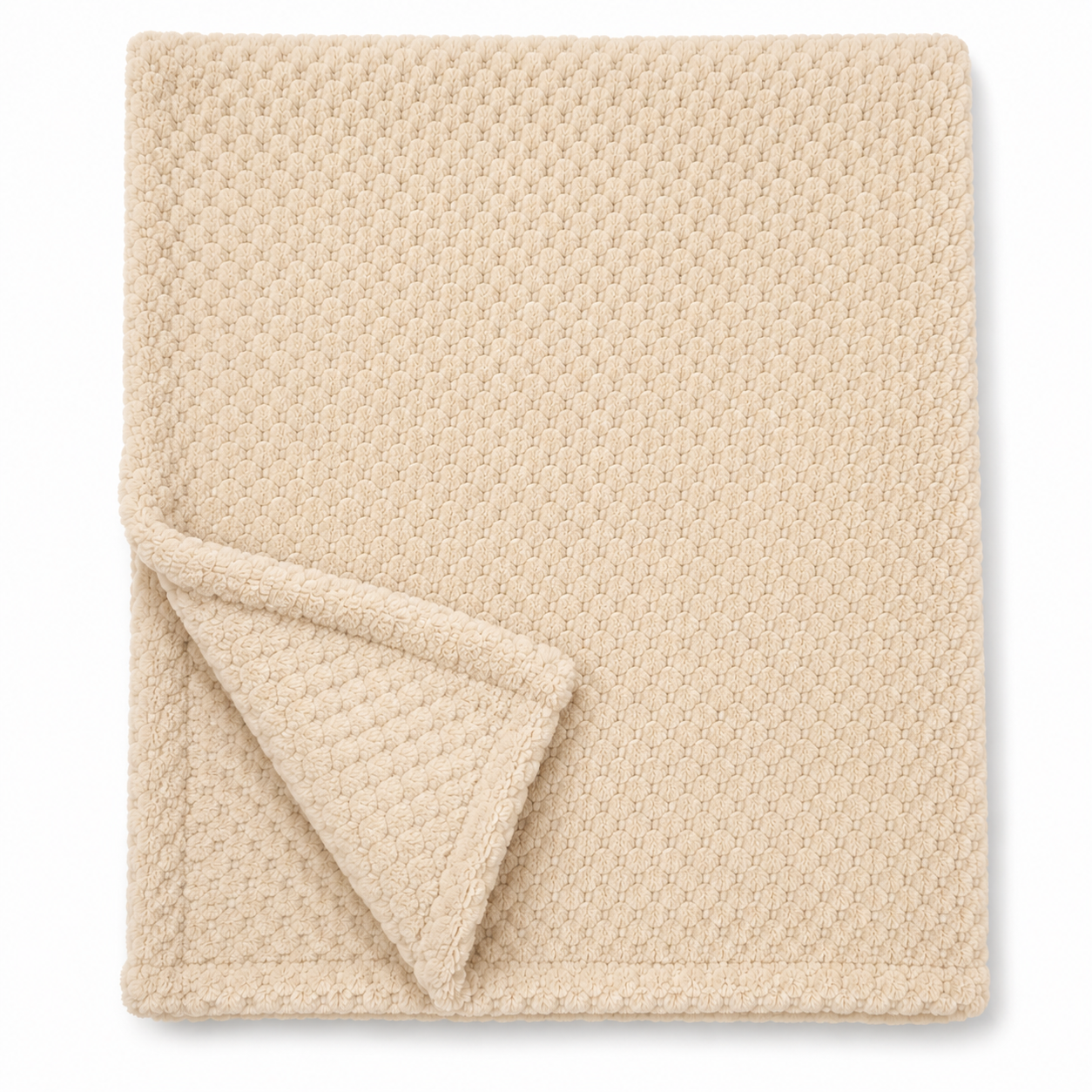 Snuggle Baby neutral beige cosy baby wrap — folded soft fleece wrap with waffle honeycomb texture throughout in a warm cream-beige, showing corner turned back to reveal the texture detail, on white background