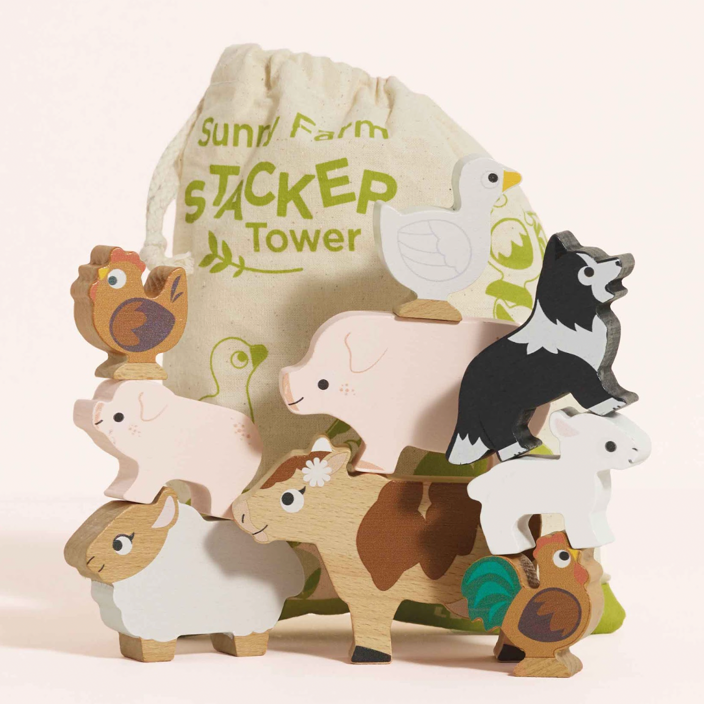 Wooden farm animal stacker toy with a drawstring bag labeled 'Sunshine Farm Stacker Tower' on a light background. FARMYARD STACKING WOODEN ANIMALS & BAG | LE TOY VAN