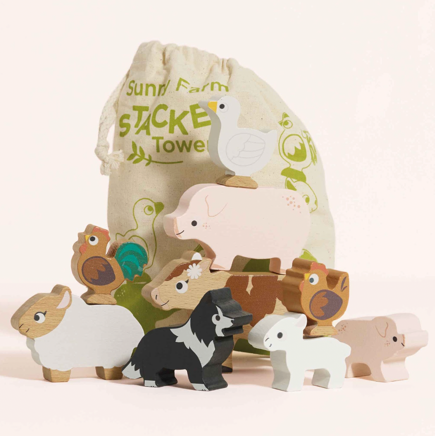 Set of wooden farm animal toys with a drawstring bag labeled 'Sunny Farm' on a light background. FARMYARD STACKING WOODEN ANIMALS & BAG | LE TOY VAN