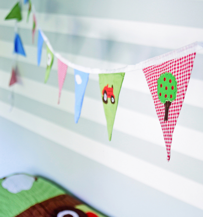 Colorful fabric bunting with cartoon designs. FARMYARD THEMED BUNTING FOR BEDROOM & PARTY DECORATION | POWELL CRAFT