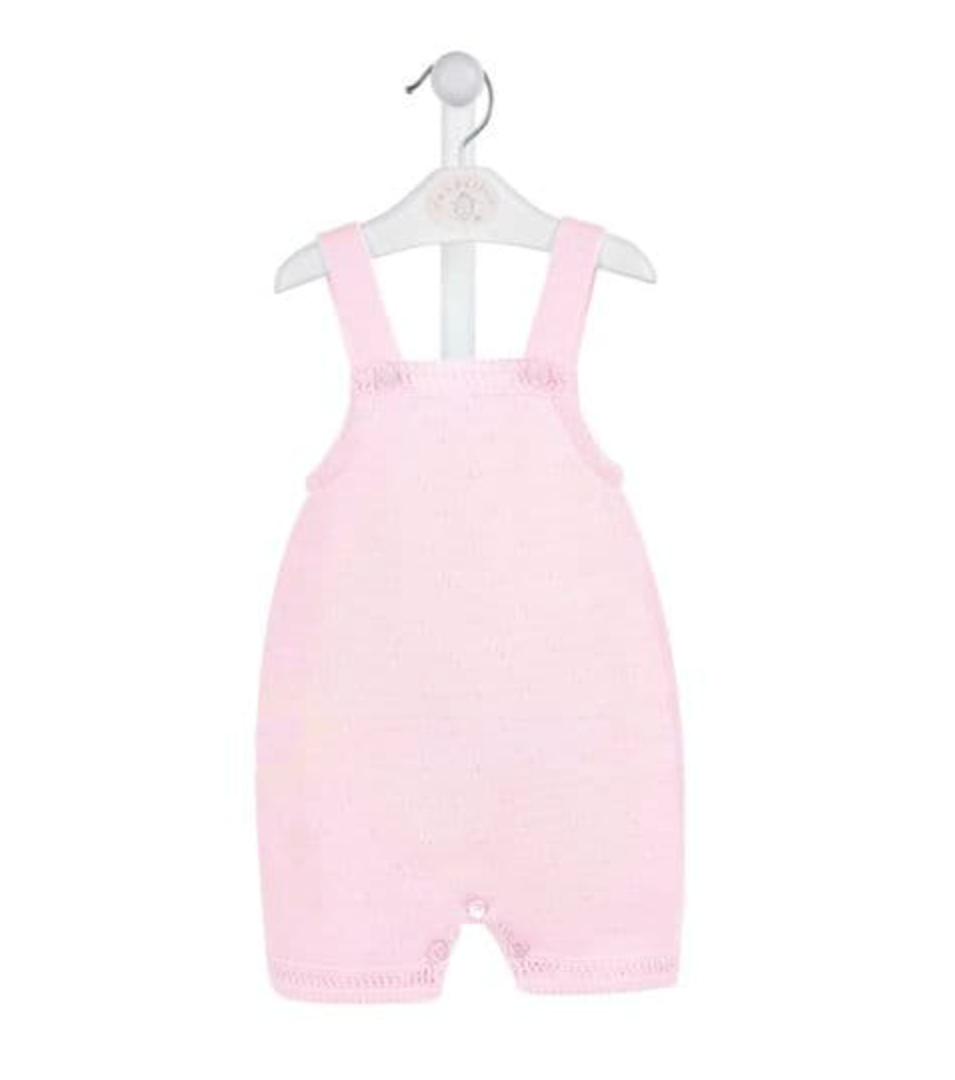 A pink knitted romper for babies, displayed on a hanger. FINE KNIT BABY ROMPER - BABY PINK | DANDELION