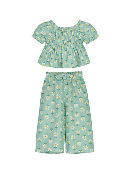 Girls Children's summer outfit with floral top and pants on a white background