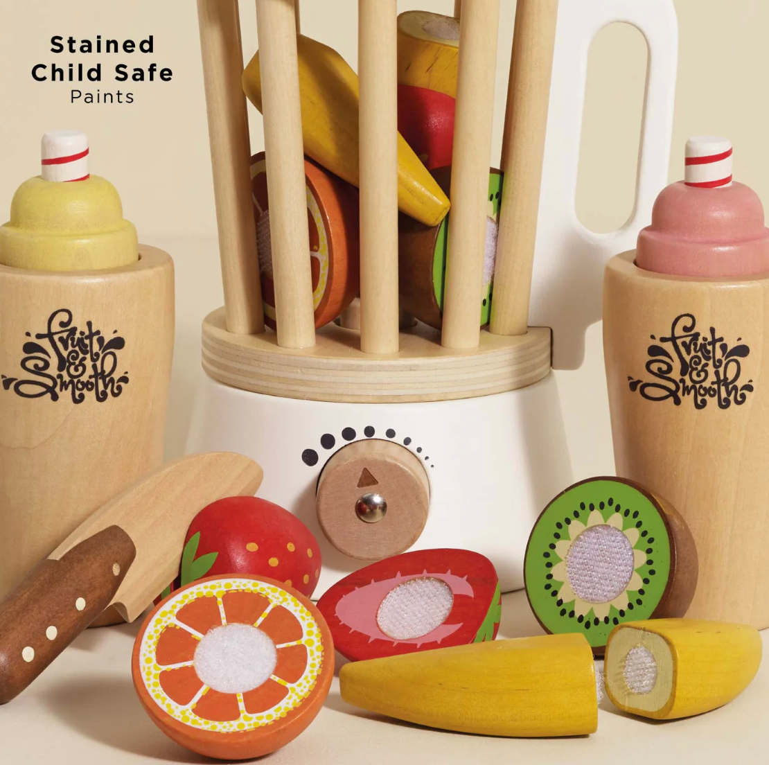 Wooden toy set with fruits and kitchen utensils on a white background, featuring 'Twist & Squeeze' branding. FRUIT & SMOOTHIE WOODEN TOY BLENDER SET | LE TOY VAN