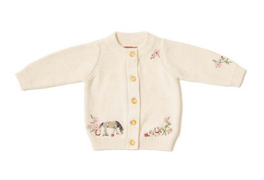Knitted baby cardigan with embroidered designs. GIRLS ORGANIC COTTON HORSE SHOW FLORAL CARDIGAN | ELEANOR CHARLES