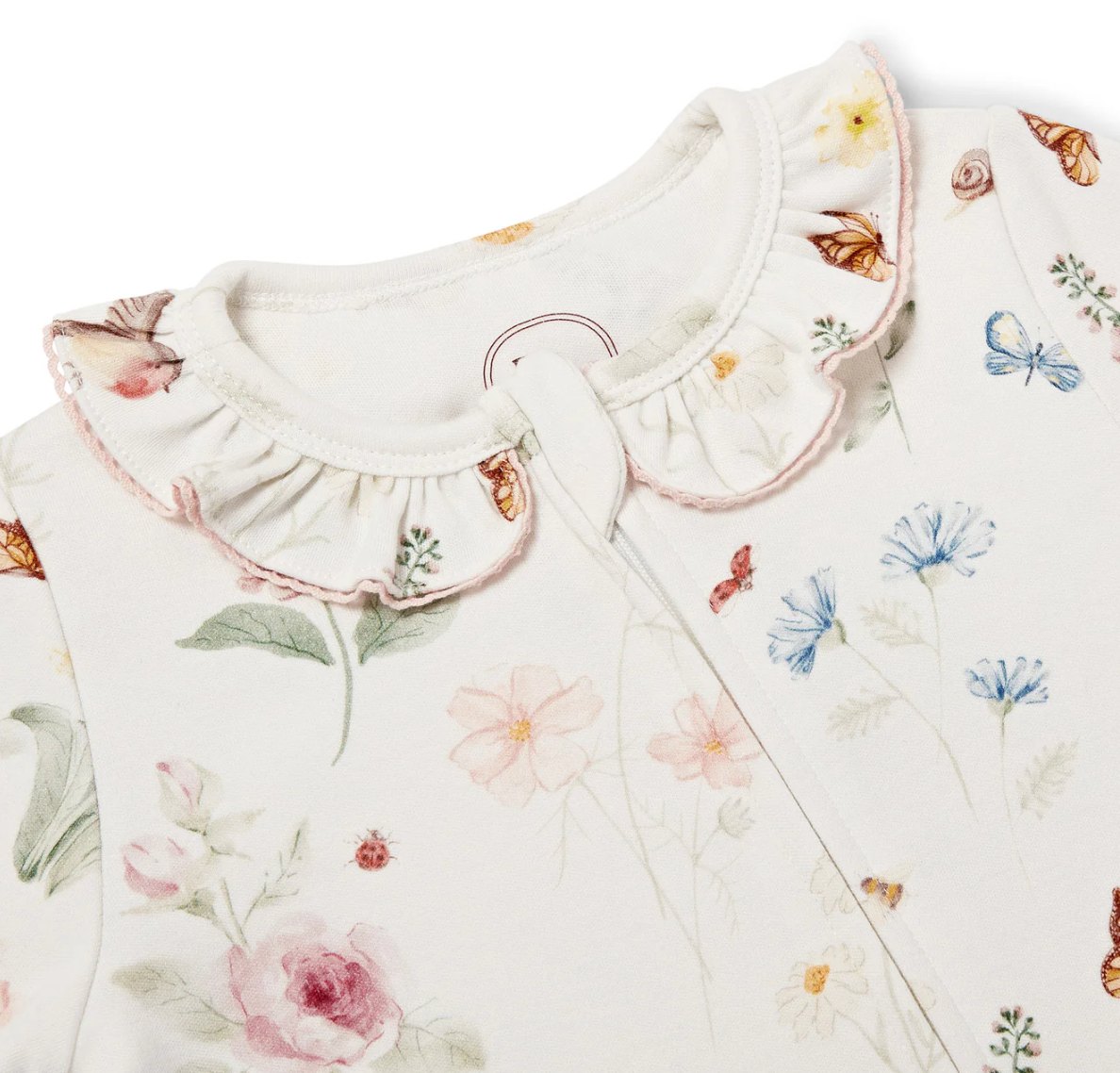 Floral and butterfly patterned fabric with a ruffled collar. GIRLS THE ENGLISH GARDEN PRINT FRILL ORGANIC COTTON ZIP SLEEPSUIT | ELEANOR CHARLES