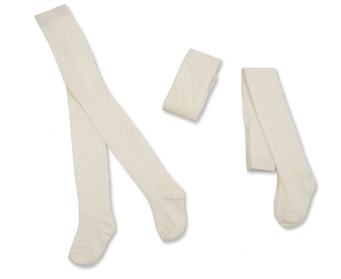 Nursery Time Super Soft Cotton Cream Tights shown on a white background in three presentations: a full pair laid out flat on the left showing the full leg and foot length, a small folded pair in the centre, and a partial pair laid diagonally on the right; all in warm cream or ivory with a smooth fine-knit fabric and a plain unembellished finish throughout