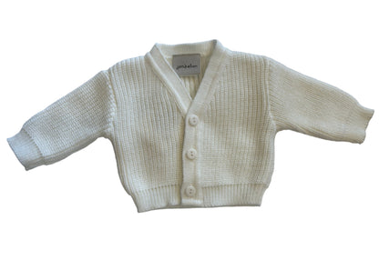 Baby cardigan with buttons on a white background