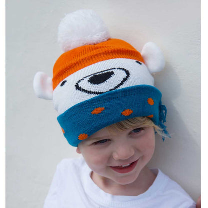 Child wearing a colorful knit hat with a bear design. KID'S POLAR BEAR KNITTED HAT WITH POM-POM | POWELL CRAFT
