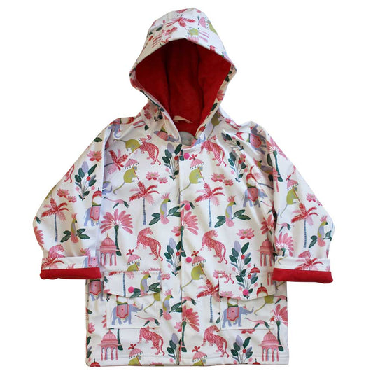 A hooded raincoat with a paradise garden print featuring animals such as tigers, elephants, and monkeys, and plants like palms and lotus flowers, predominantly in white with red lining and multicolored print. KID'S SULTAN'S GARDEN LINED RAINCOAT - 3 SIZES | POWELL CRAFT