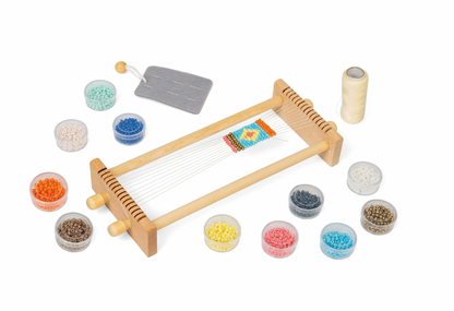 Wooden weaving loom with colorful beads. KID'S WOODEN BEAD WEAVING LOOM | BIGJIGS